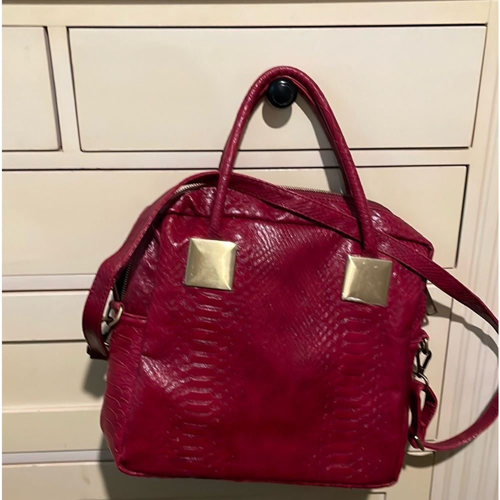 Red Ranson brand  with the color gold buckles. Never used in great condition.